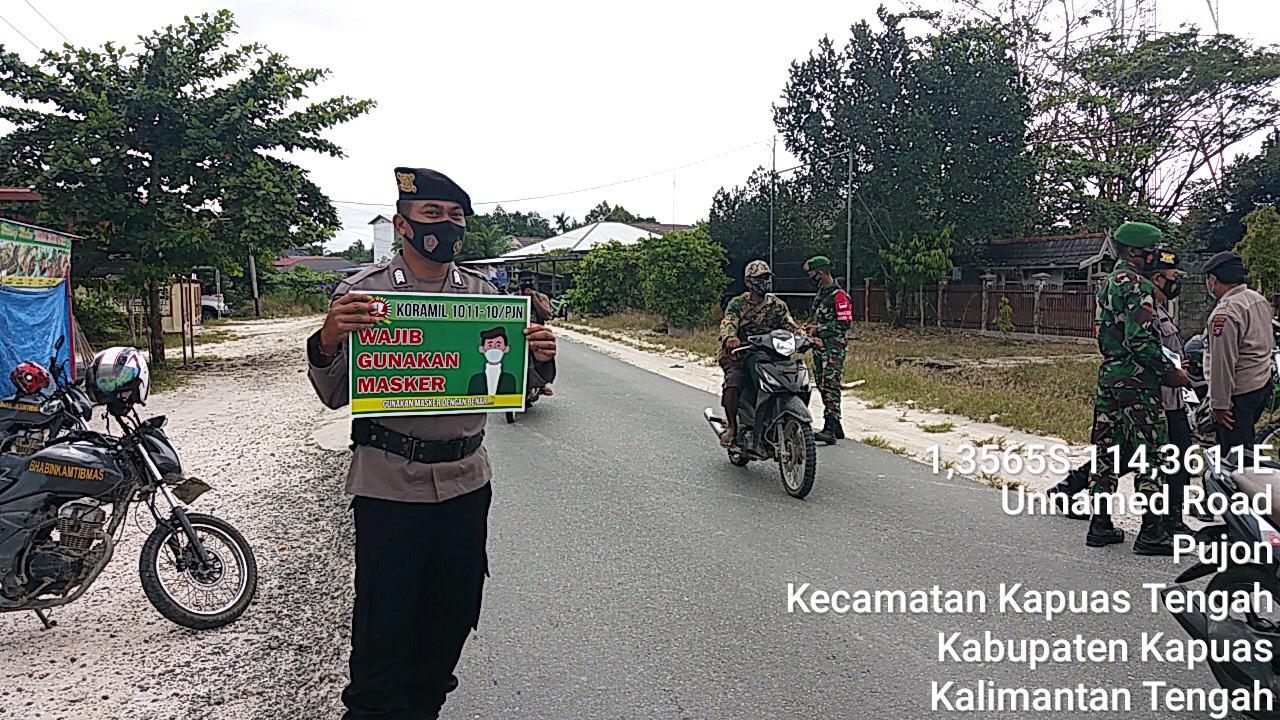 Gunakan Papan Portable, Polsek Kapuas Tengah Imbau Warganya Gunakan Masker
