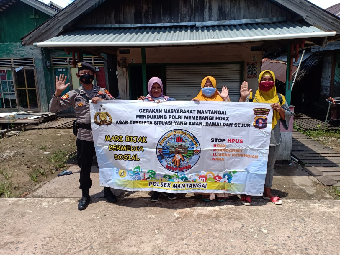 Melalui Media Spanduk, Aipda Sidik Sosialisasikan HPUS Kepada Warga Mantangai